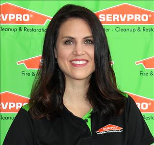 image of female employee standing in front of SERVPRO backdrop