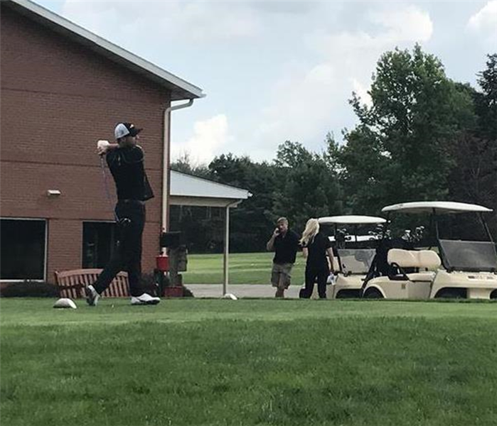 Photo of SERVPRO employee golfing